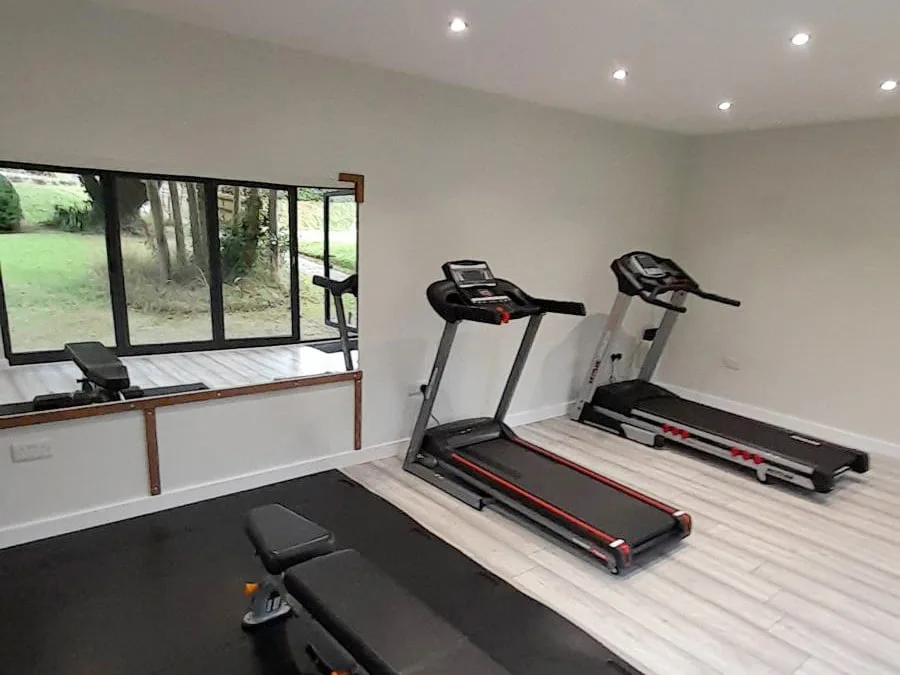 Exercise equipment inside a finished garden gym